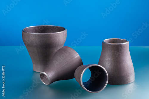 Concentric reducers, set of steel welding fittings. photo