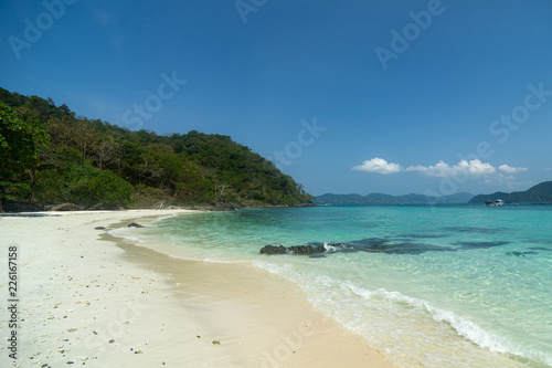 A beach with golden sand. Ships in the turquoise sea. Samui island  Thailand