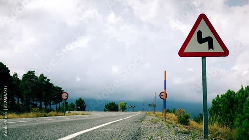 Time lapse of curling clouds above windy road in Sierra Nevada mountains, Spain
