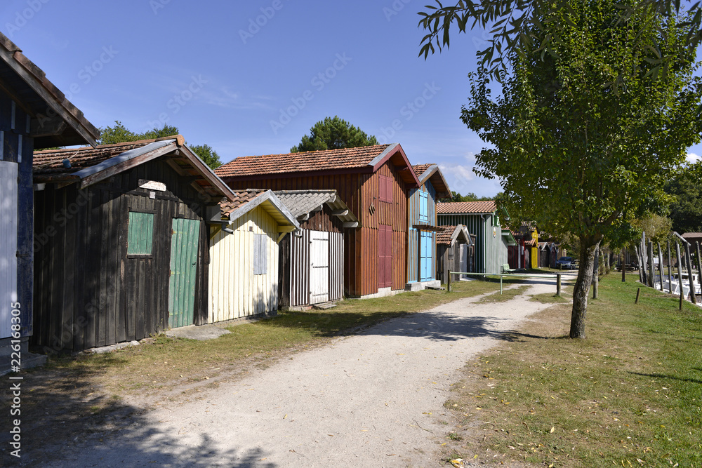 Wooden houses at ostreicole harbor of Biganos, commune is a located on the shore of Arcachon Bay, in the Gironde department in southwestern France.