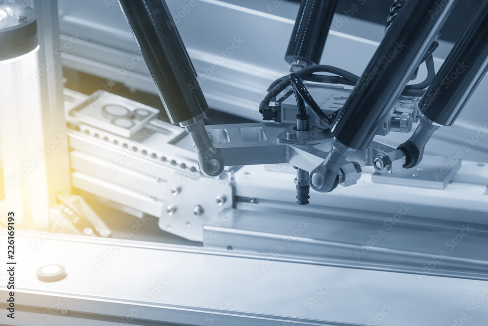 The robot arm catch for electronic assembly line. The robot for hi-technology manufacturing process. The robot arm catch for electronic assembly line. The robot for hi-technology manufacturing process.