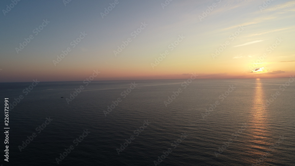 Obraz premium Ocean at sunrise aerial view