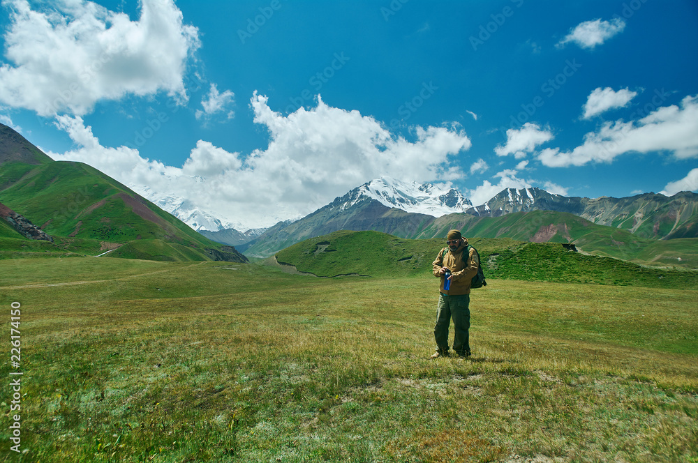 caucasian man with  backpacks View from p Pamir