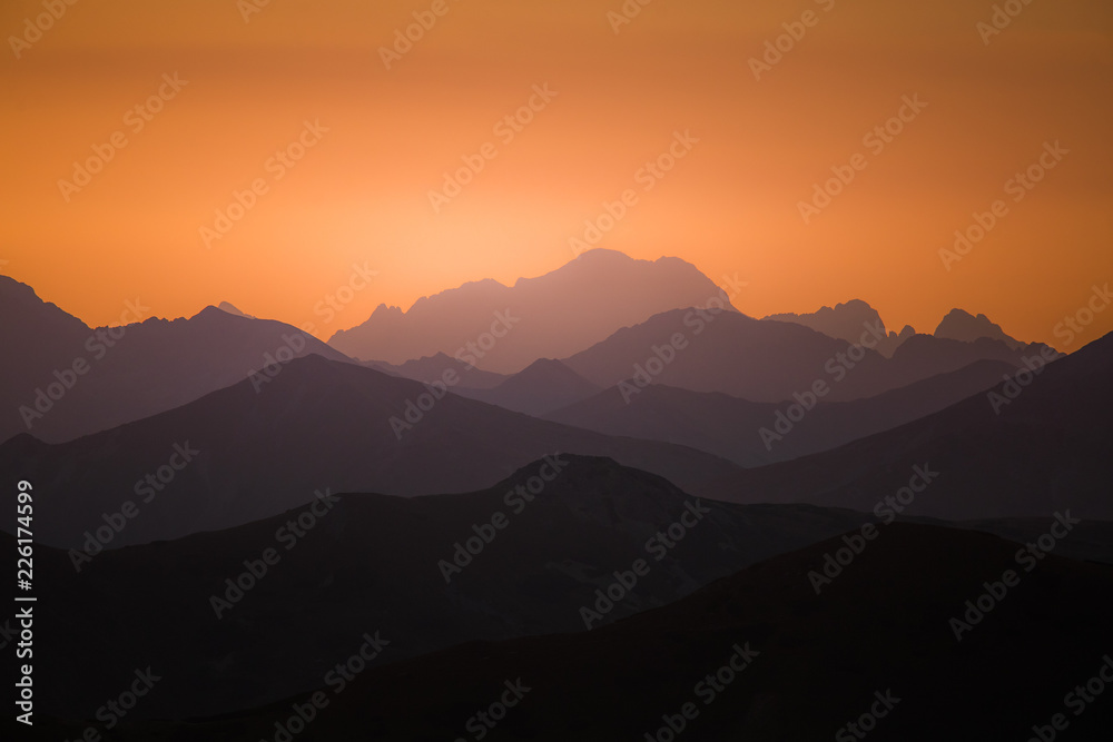 A beautiful, colorful, abstract mountain scenery in sunrise. Minimalist landscape of mountains in morning in blue tones. Tatra mounains in Slovakia, Europe. A beautiful, colorful, abstract mountain scenery in sunrise. Minimalist landscape of mountains in morning in blue tones. Tatra mounains in Slovakia, Europe.