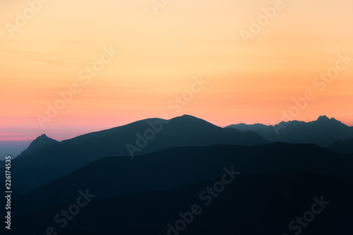 A beautiful  colorful  abstract mountain scenery in sunrise. Minimalist landscape of mountains in morning in blue tones. Tatra mounains in Slovakia  Europe.