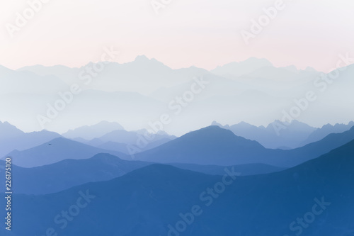 Fototapeta Naklejka Na Ścianę i Meble -  Colorful, abstract double exposure of mountains in sunrise. Minimalist scenery with color gradients. Tatra mountains in Slovakia, Europe.