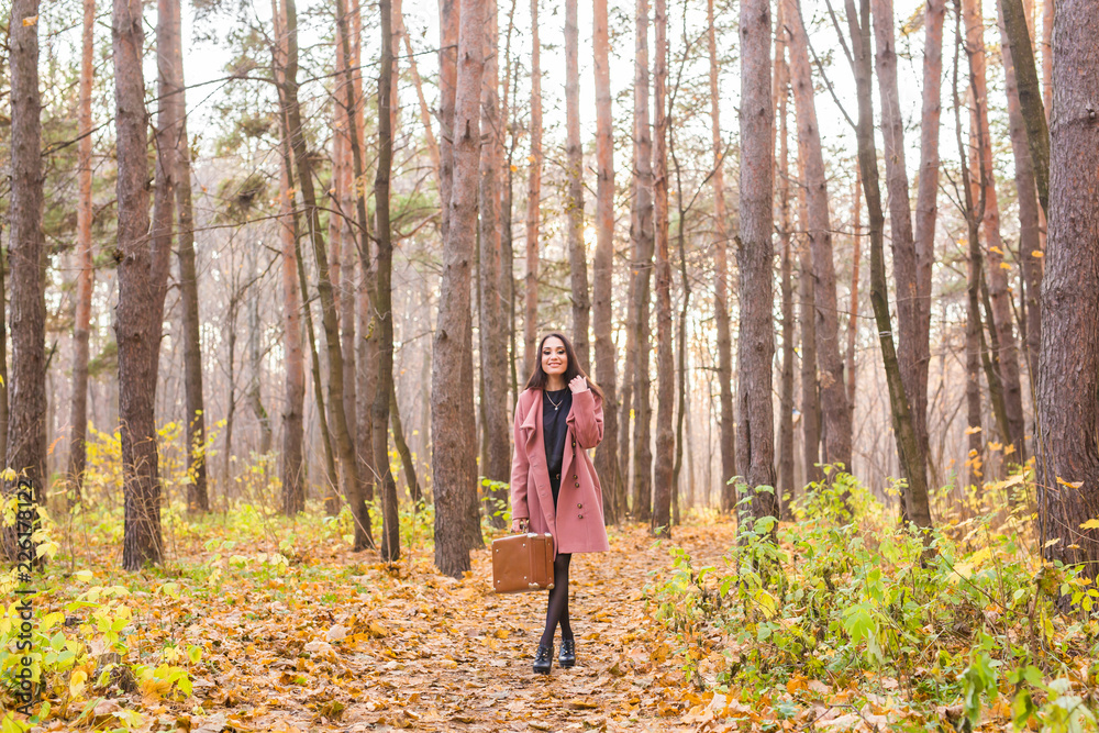 Portrait of beautiful young woman walking outdoors in autumn. Portrait of beautiful young woman walking outdoors in autumn.