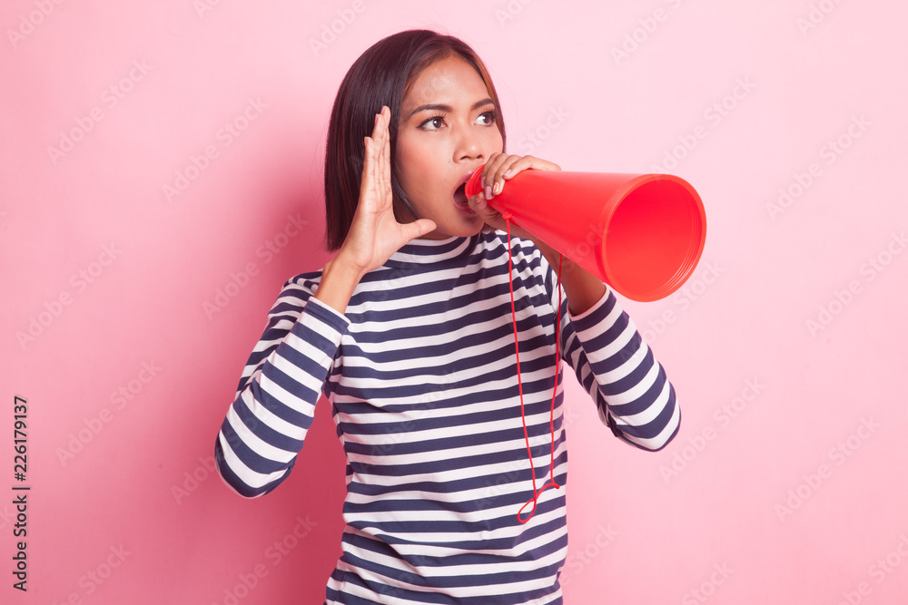 Beautiful young Asian woman announce with megaphone. Beautiful young Asian woman announce with megaphone.