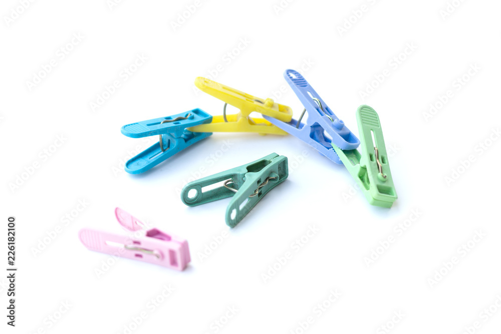 Pile of colorful clothespins isolated on white background Pile of colorful clothespins isolated on white background