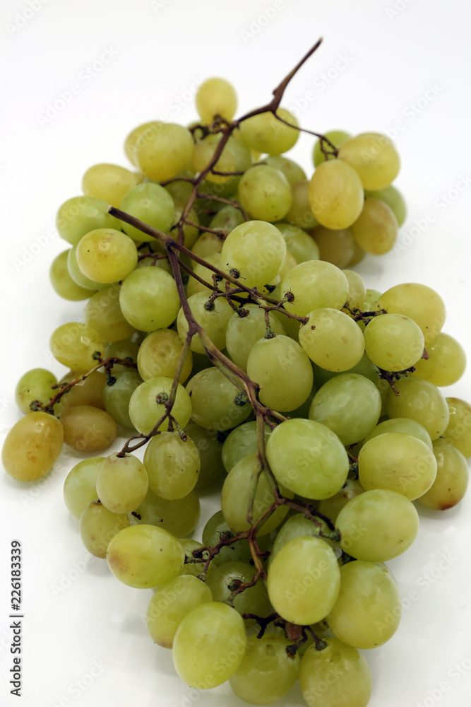 Big, white grape close-up on white background. Big, white grape close-up on white background.
