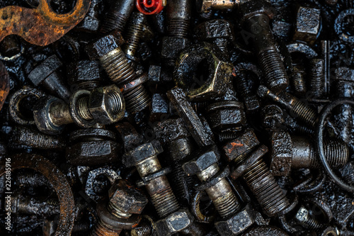 Background of old used nuts and bolts