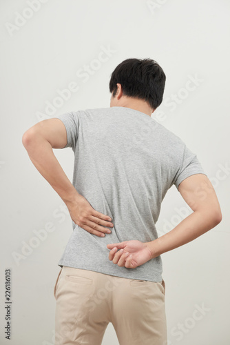 Man with back pain isolated on white background