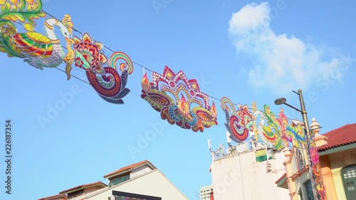 Close up of the diwali decoration at Singapore little india district along Serangoon Road on a bright sunny day with blue sky in 4K photo