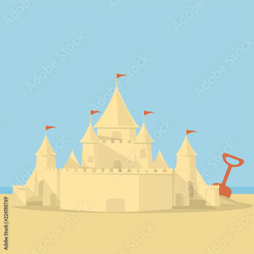 sand castle on the background of the sea and the beach