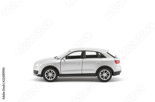 Silver toy car with clipping path on white background © Jakub Krechowicz
