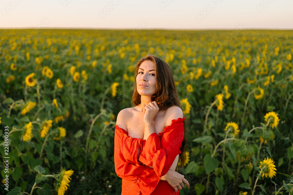 Beauty joyful girl in sunflower field Beauty joyful girl in sunflower field