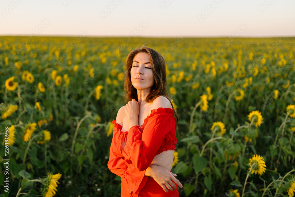 Beauty joyful girl in sunflower field Beauty joyful girl in sunflower field