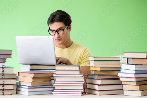 Student with too many books to read before exam