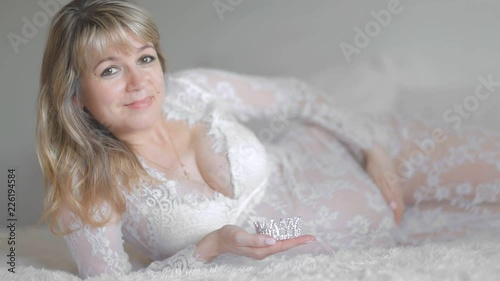 portrait pregnant woman in bed 45 years old\ photo
