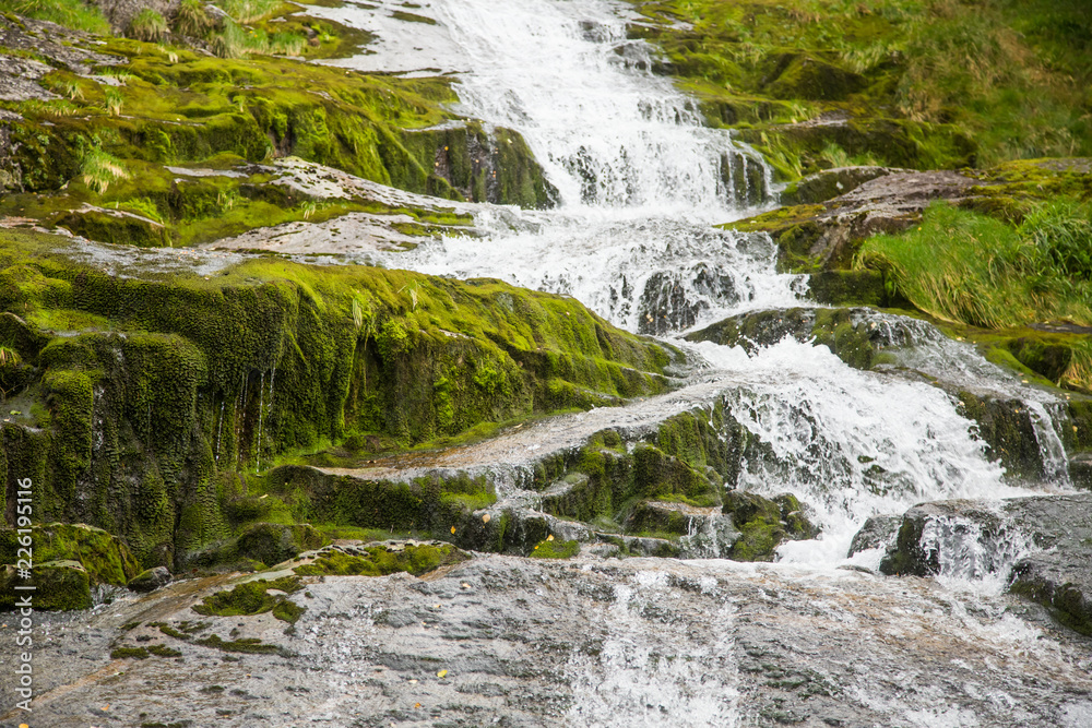 A beautiful mountain river rapids in mountains of Folgefonna National park in Norway. Autumn landscape of a river rapids. A beautiful mountain river rapids in mountains of Folgefonna National park in Norway. Autumn landscape of a river rapids.