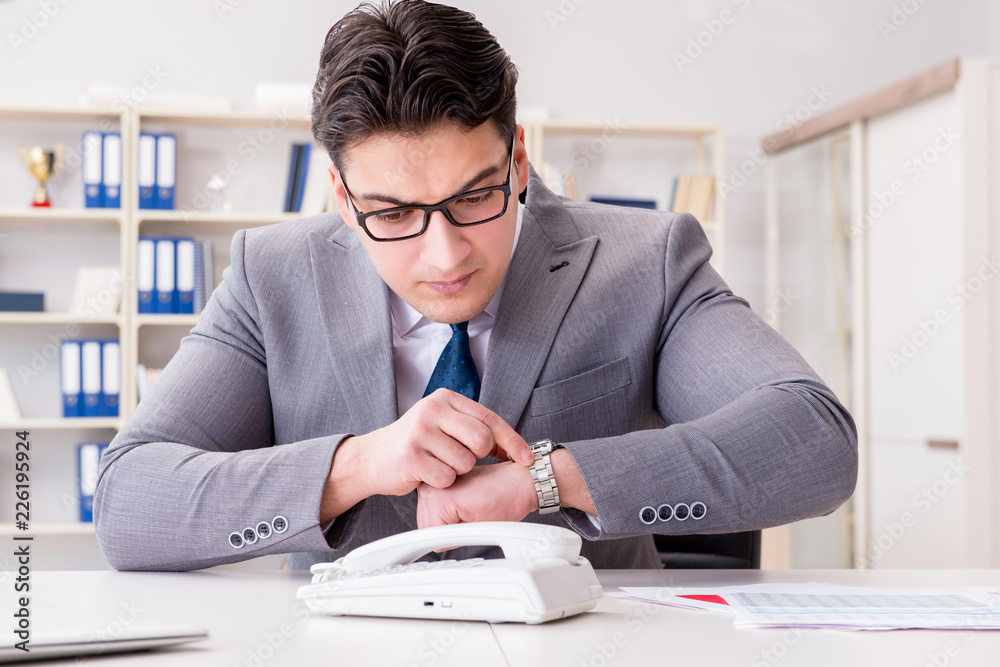 Businessman expecting important call on phone Businessman expecting important call on phone