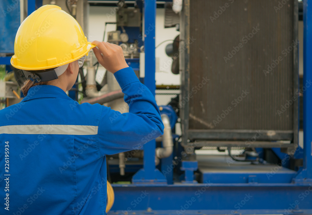 Engineer woman in industry factory checking production. Engineer woman in industry factory checking production.