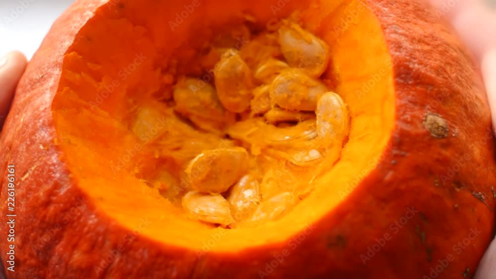Close-up of the pulp and seeds inside the fresh hokkaido pumpkin. Close-up of the pulp and seeds inside the fresh hokkaido pumpkin.