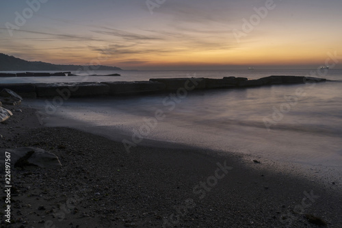 Meeting the sunrise on the beach.