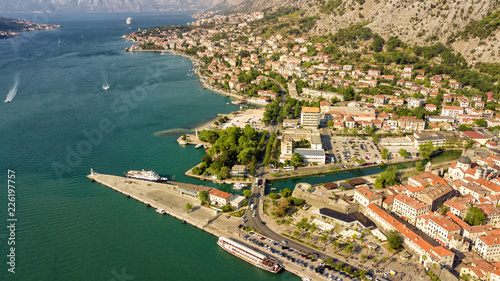 Panoramic aerial view of the red tiled roofs of the old town of Kotor and Kotor Bay