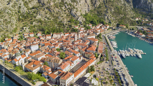 Panoramic aerial view of the red tiled roofs of the old town of Kotor and Kotor Bay © savantermedia
