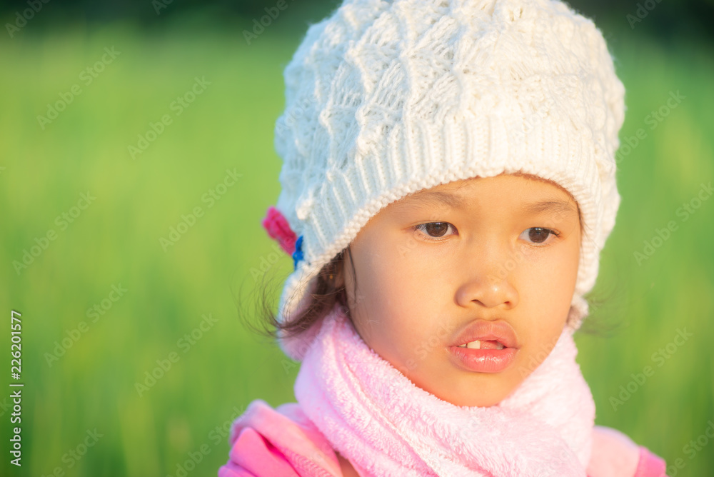 Portrait of young beautiful asian girl outdoor in winter with warm blured sunset light. Portrait of young beautiful asian girl outdoor in winter with warm blured sunset light.