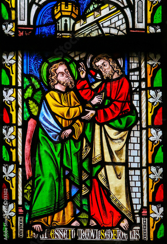Jesus to Saint Thomas: Stop doubting, but believe - Stained Glass photo