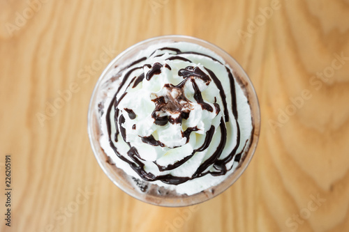 Top view whipping cream with chocolate in the cup.