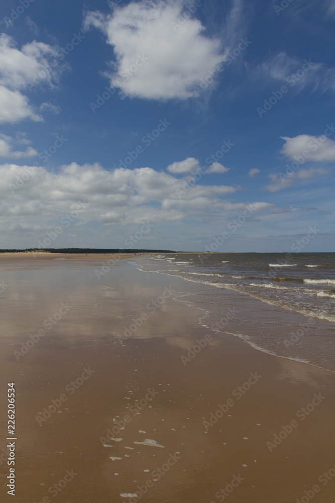 Clouds reflecting on the wet sand at Wells-next-the-Sea, Norfolk