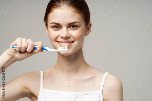 woman brushing her teeth care