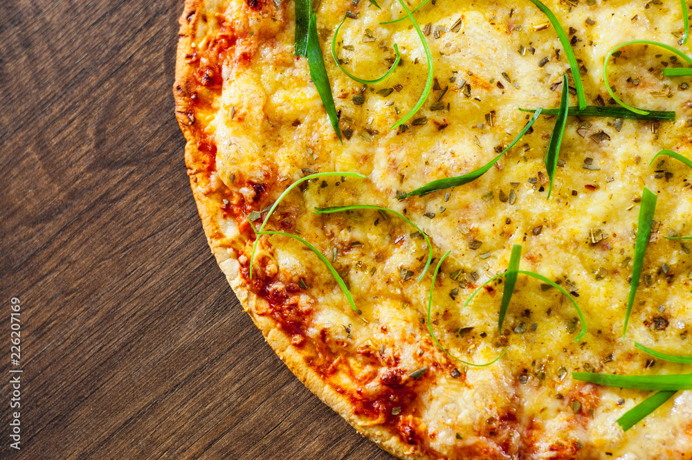 Pizza Margherita or Margarita with Mozzarella cheese. Italian pizza on wooden background Pizza Margherita or Margarita with Mozzarella cheese. Italian pizza on wooden background