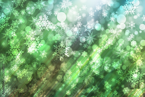 Christmas background with fir branches, glow, snowflakes and bokeh.