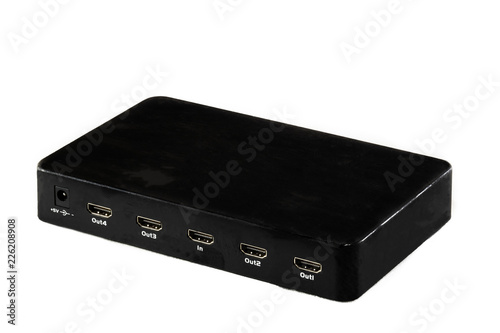 Black HDMI digital video four port splitter on white background with copyspace.