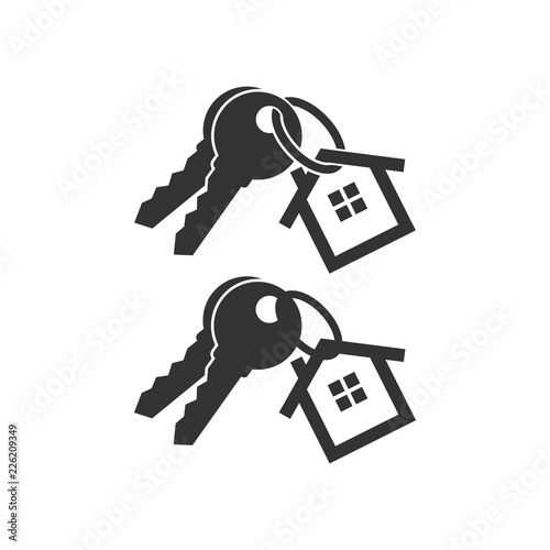 Keys with key chain ring and a house pendant. Real estate concept icon. New home logo design. Pair of house keys.