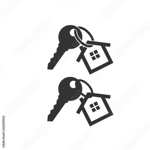 Key with key chain ring and a house pendant. Real estate concept icon. New home logo design. House key.