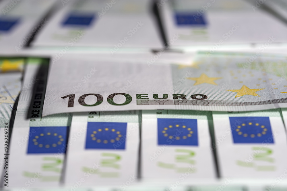 European euro currency bank notes lying on a desk close-up, symbolizing finance and business. European euro currency bank notes lying on a desk close-up, symbolizing finance and business.