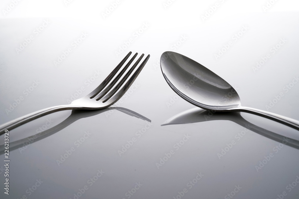 Fork & Spoon Kitchen Utensils fine art abstract on white isolated background Fork & Spoon Kitchen Utensils fine art abstract on white isolated background