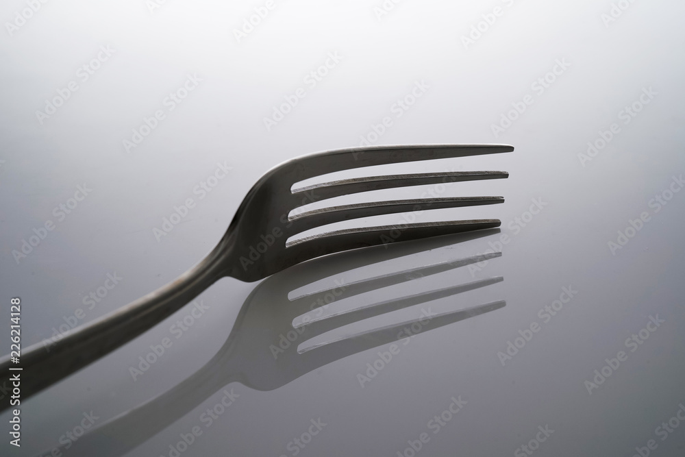 Fork & Spoon Kitchen Utensils fine art abstract on white isolated background Fork & Spoon Kitchen Utensils fine art abstract on white isolated background