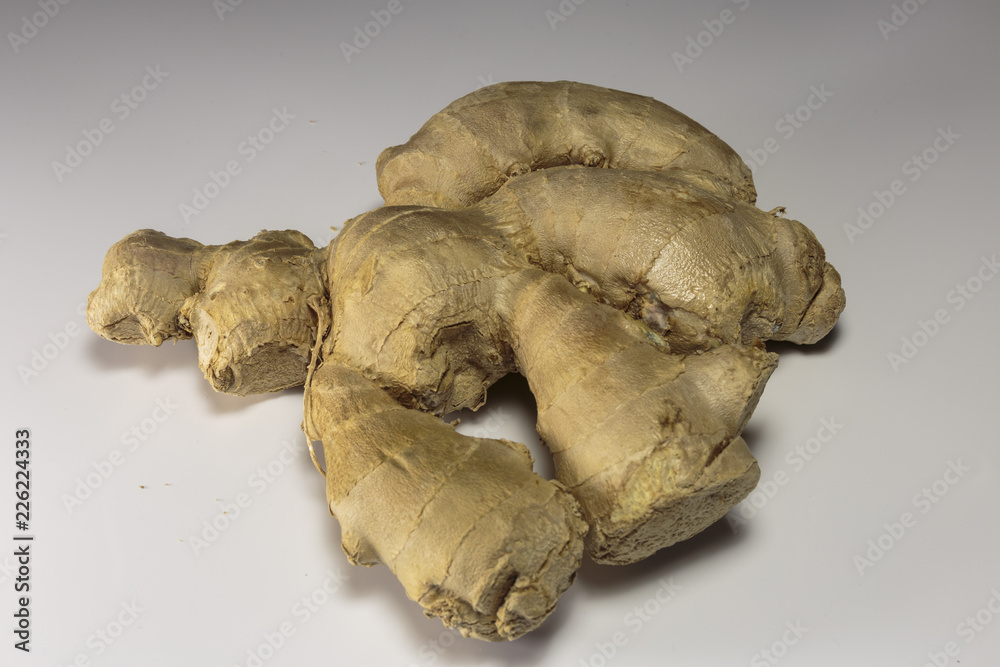 Ginger root on a white background, Asian food and popular Asian spice.