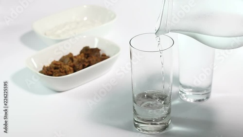 Turkish raki on white table with appetizer