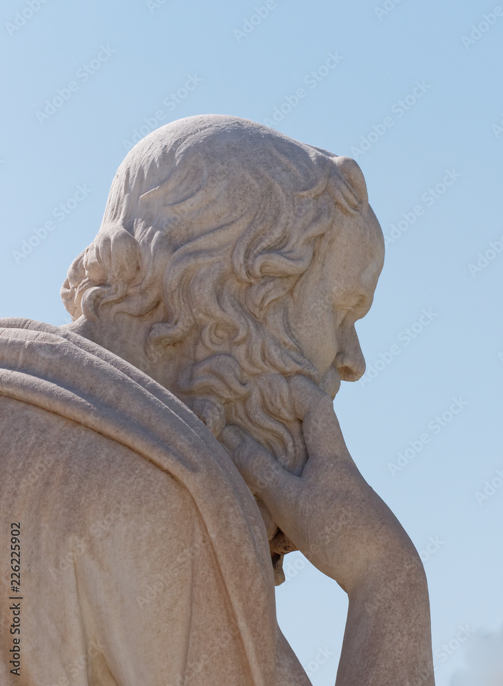 Socrates  the ancient greek philosopher portrait on blue sky background, detail of marble statue in Athens Greece