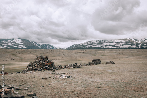 Turkic memorial structures. Turkic Stone Mens; two long lines of balbal extending toward Khurgan Lake. Nature and travel. Mongolia, Bayan-Olgii Province, Altai Tavan Bogd NP, Shar Bulag photo