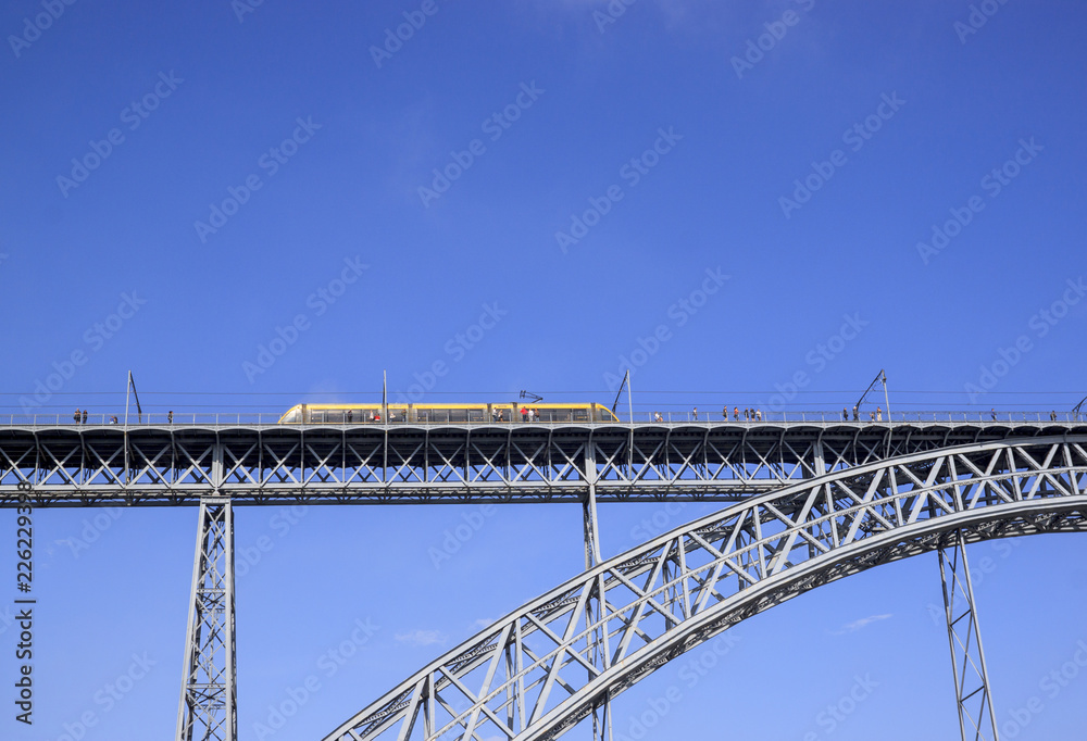 Train rides on Dom Luis I Bridge over the river Douro, Porto, Portugal.