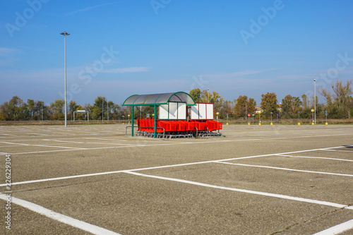 Wheel of Shopping carts on a parking lot . Detail of a shopping cart. selective focus