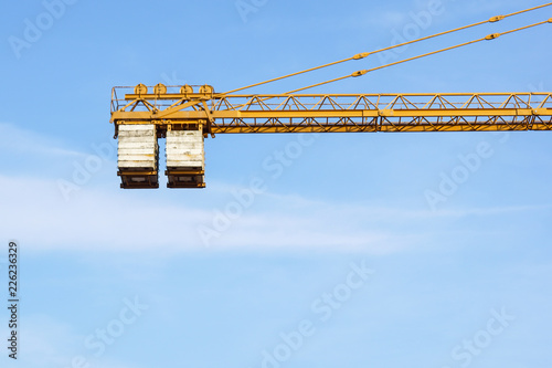 The counterweight of the tower crane at work